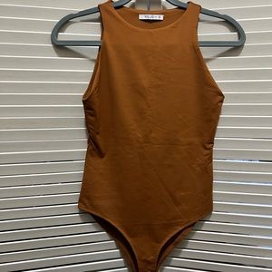 Reoria tan body suit